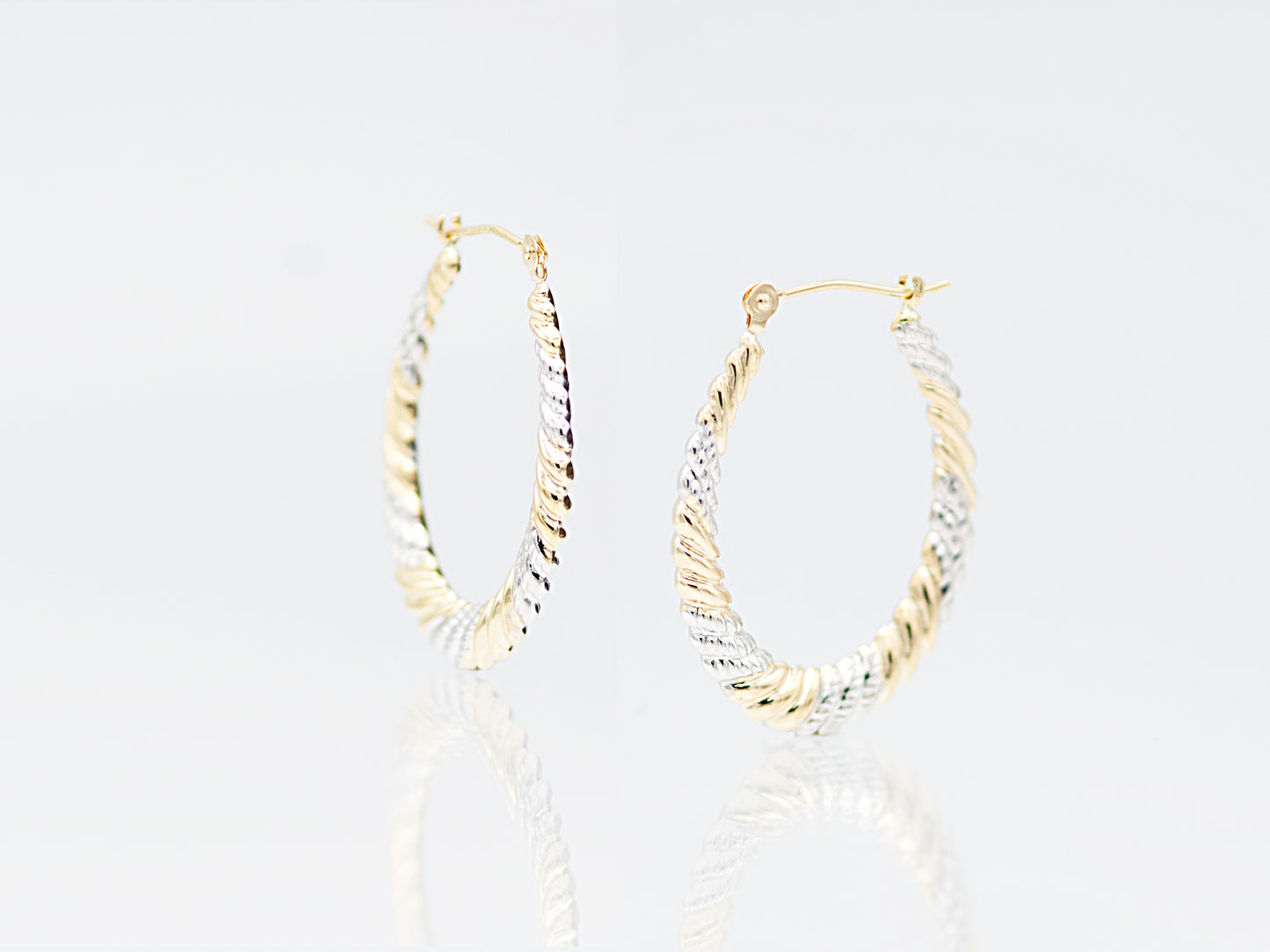 Oval twisted two tone hoop