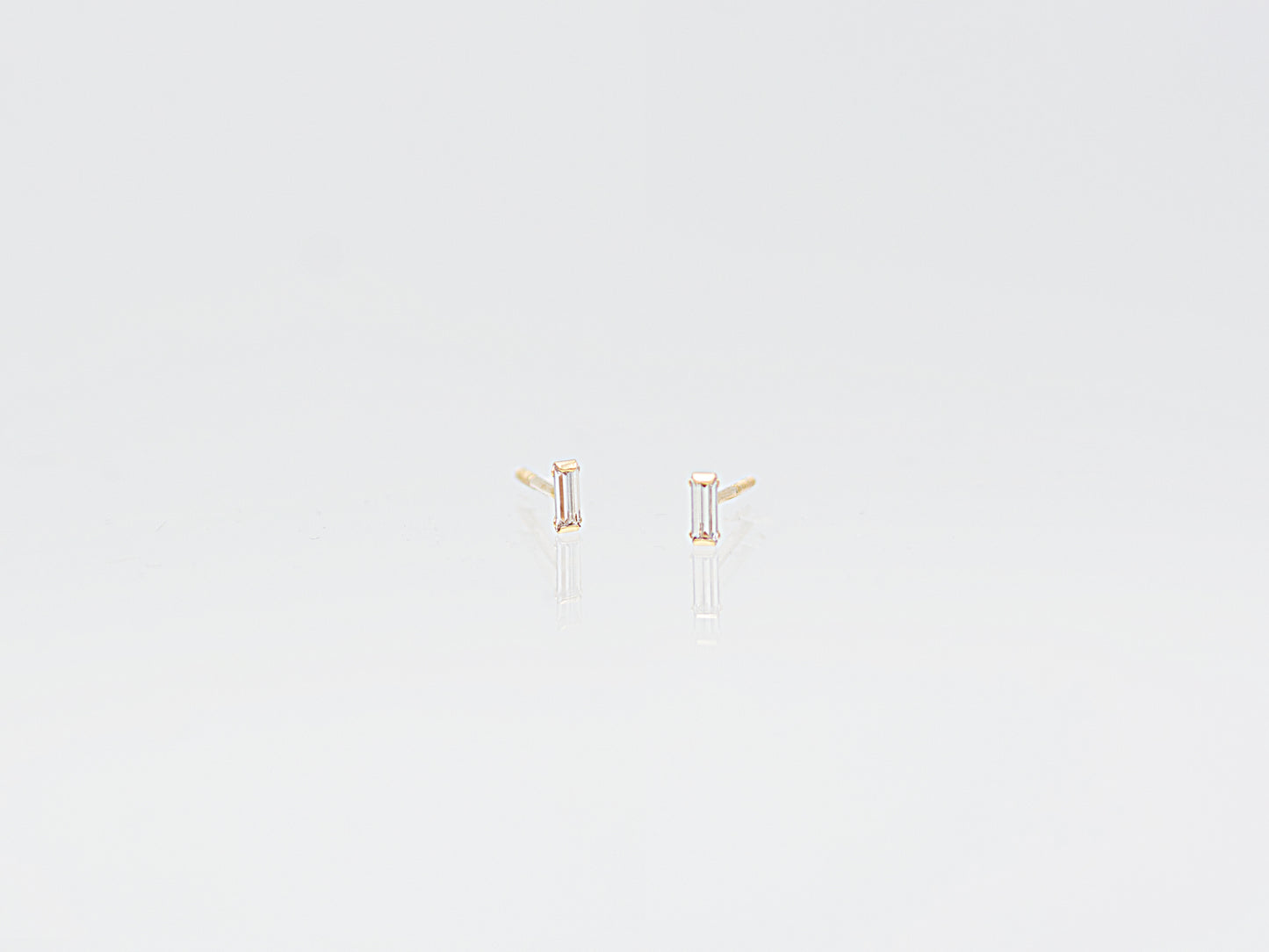 14k Solid gold emerald cut simulated diamond studs earrings